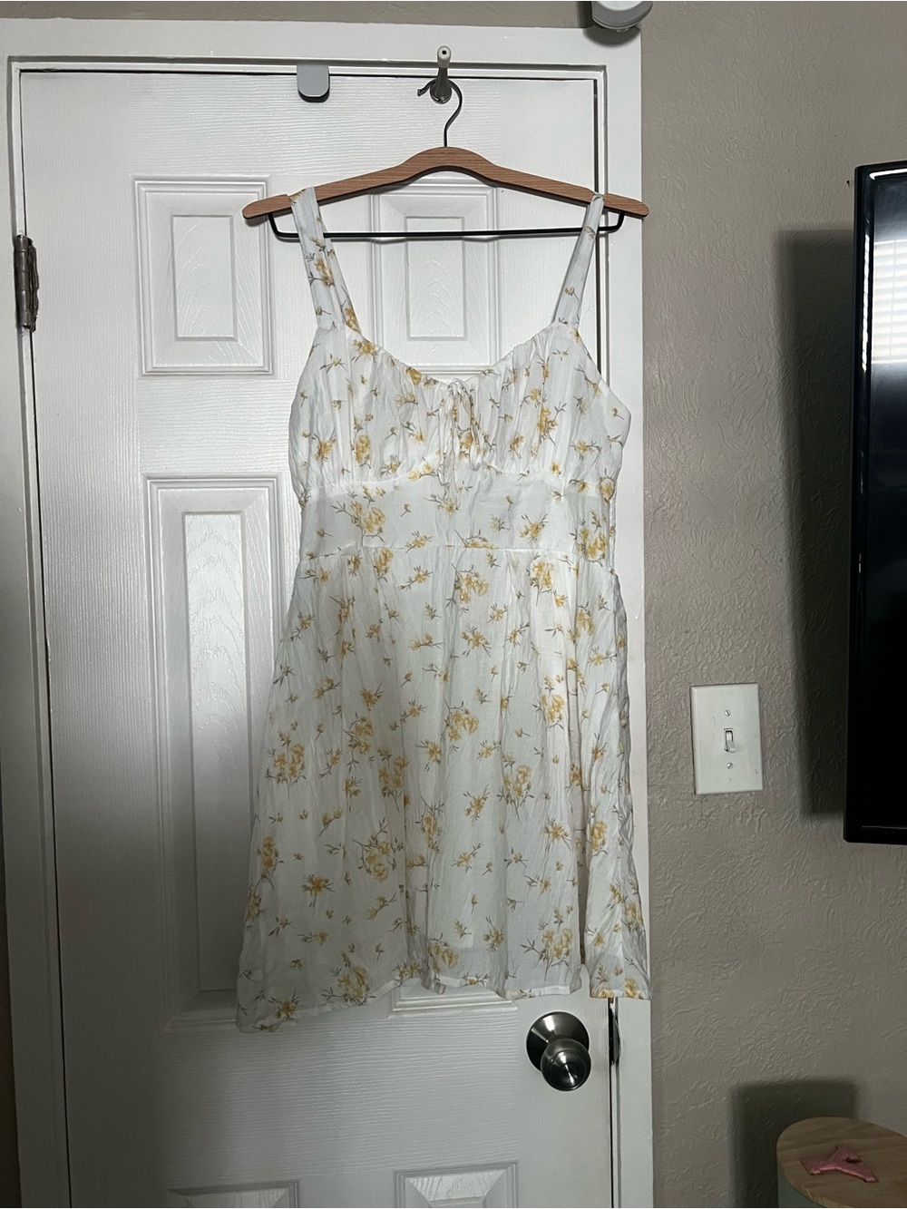 Sleeveless White Mini Dress with Yellow Floral Print